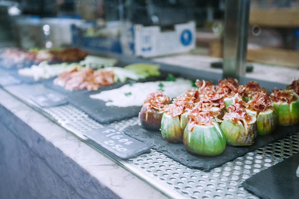 Delicious exotic stuffed figs served on counter in market